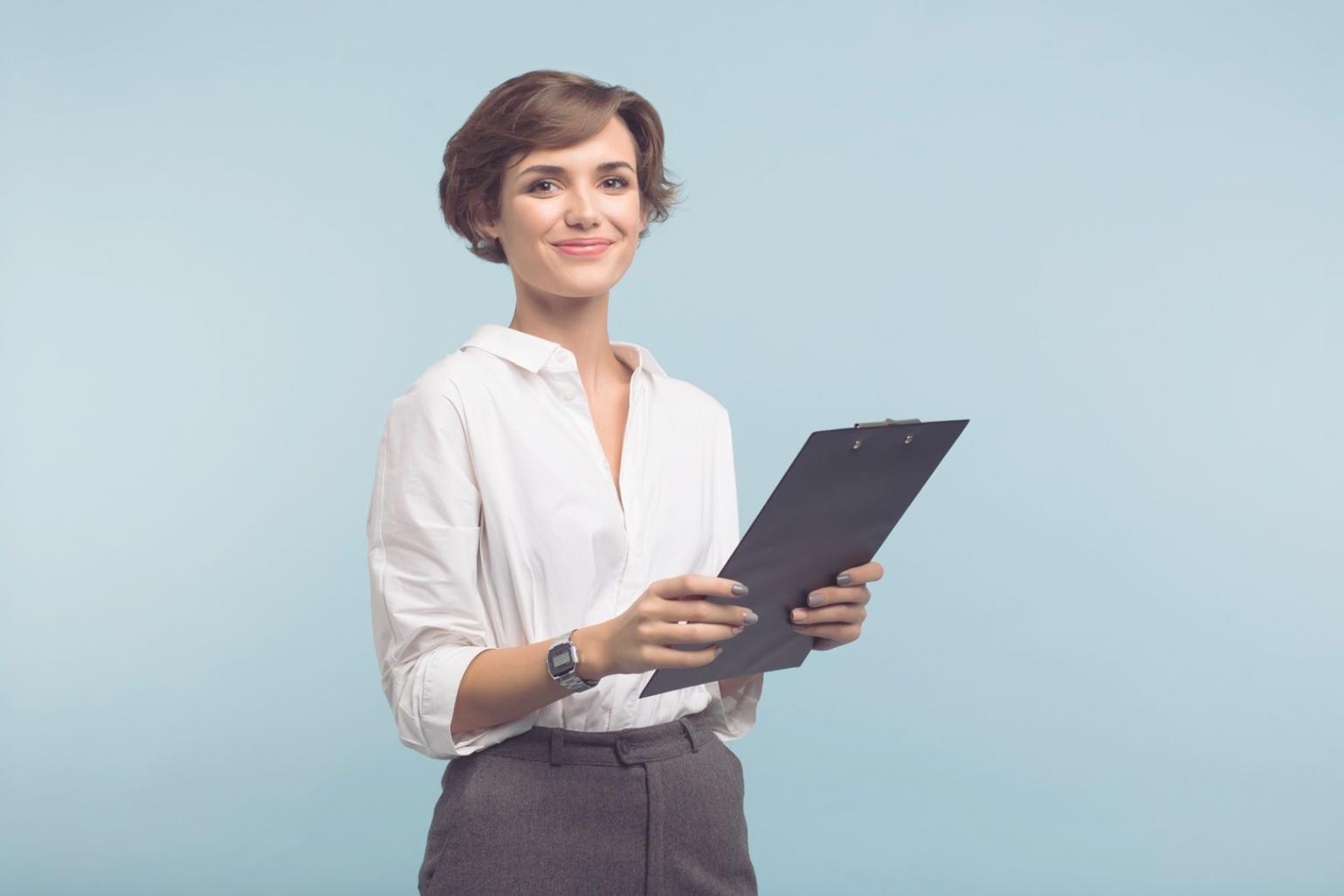 Financial analyst reviewing market data and charts on multiple screens