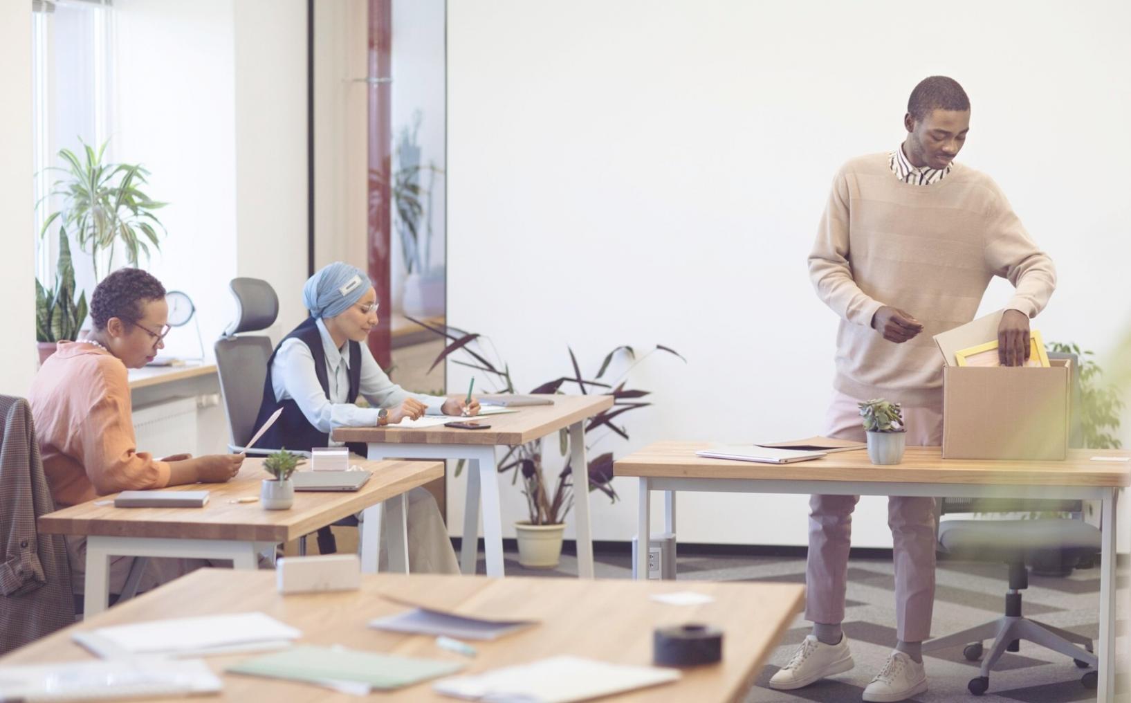 Professional working with financial documents and calculator on desk