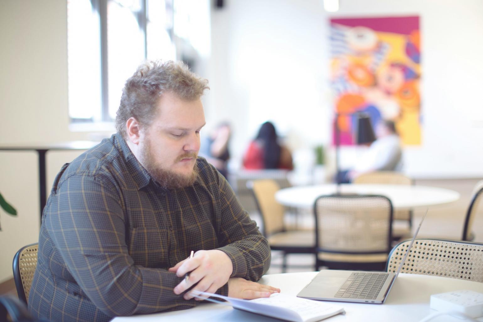 Financial data analysis with computer screens showing market trends and statistics