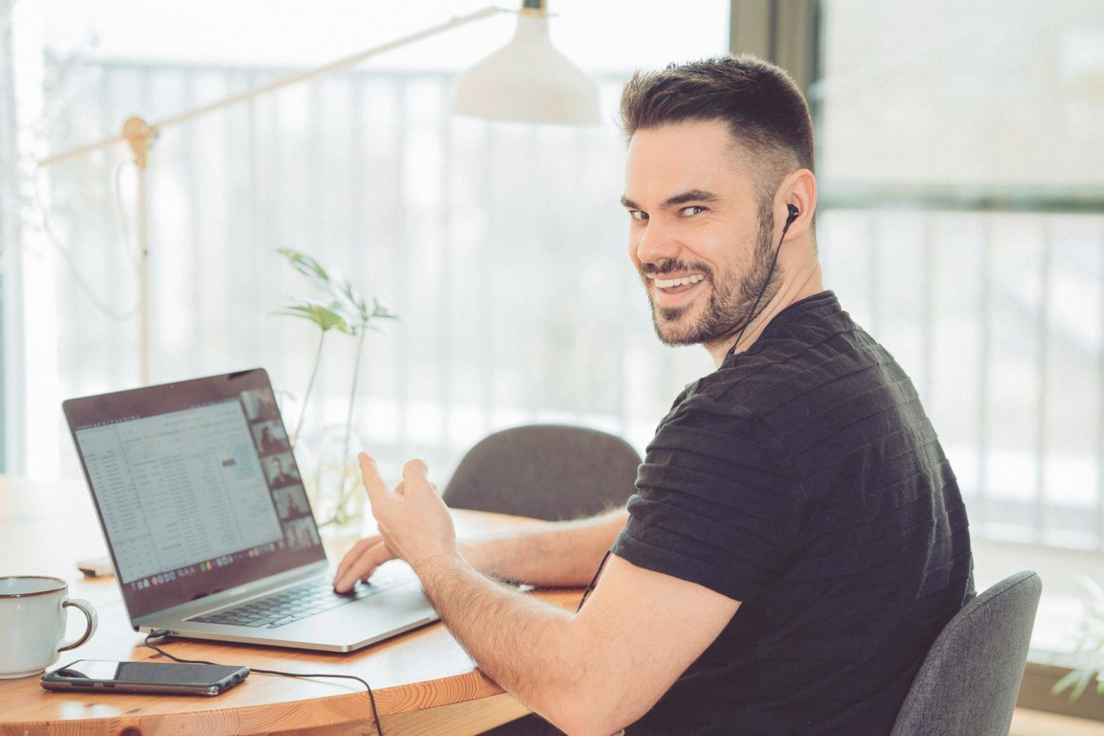 Group of professionals collaborating on financial analysis project with documents and laptops